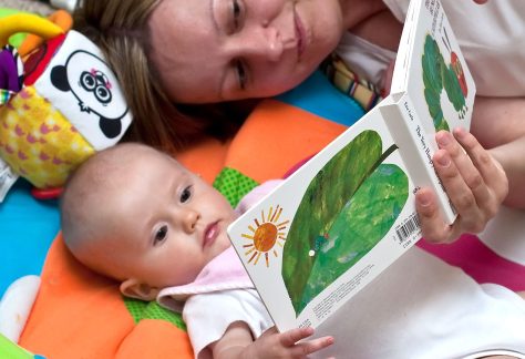 Woman reading to baby